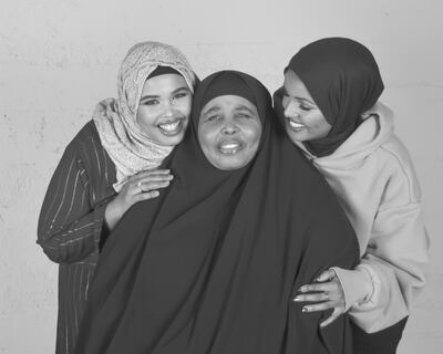 Halima Aden, far right, with her mother and sister. Courtesy Halima Aden