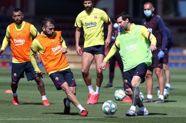 BARCELONA, SPAIN - MAY 19: Lionel Messi and Jordi Alba of FC Barcelona compete for the ball during a training session at Ciutat Esportiva Joan Gamper on May 19, 2020 in Barcelona, Spain. Spanish LaLiga clubs are back training in groups of up to 10 players following the LaLiga's 'Return to Training' protocols. (Photo by Handout/Getty Images)