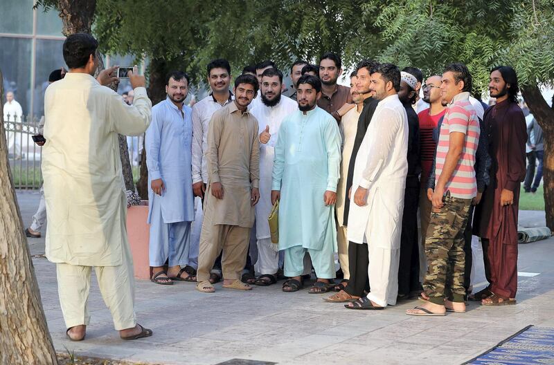 DUBAI, UNITED ARAB EMIRATES, August 21 – 2018 :- People taking pictures after the Eid Al Adha prayers at the Jumeirah Mosque in Dubai. ( Pawan Singh / The National )  For News. Story by Nawal