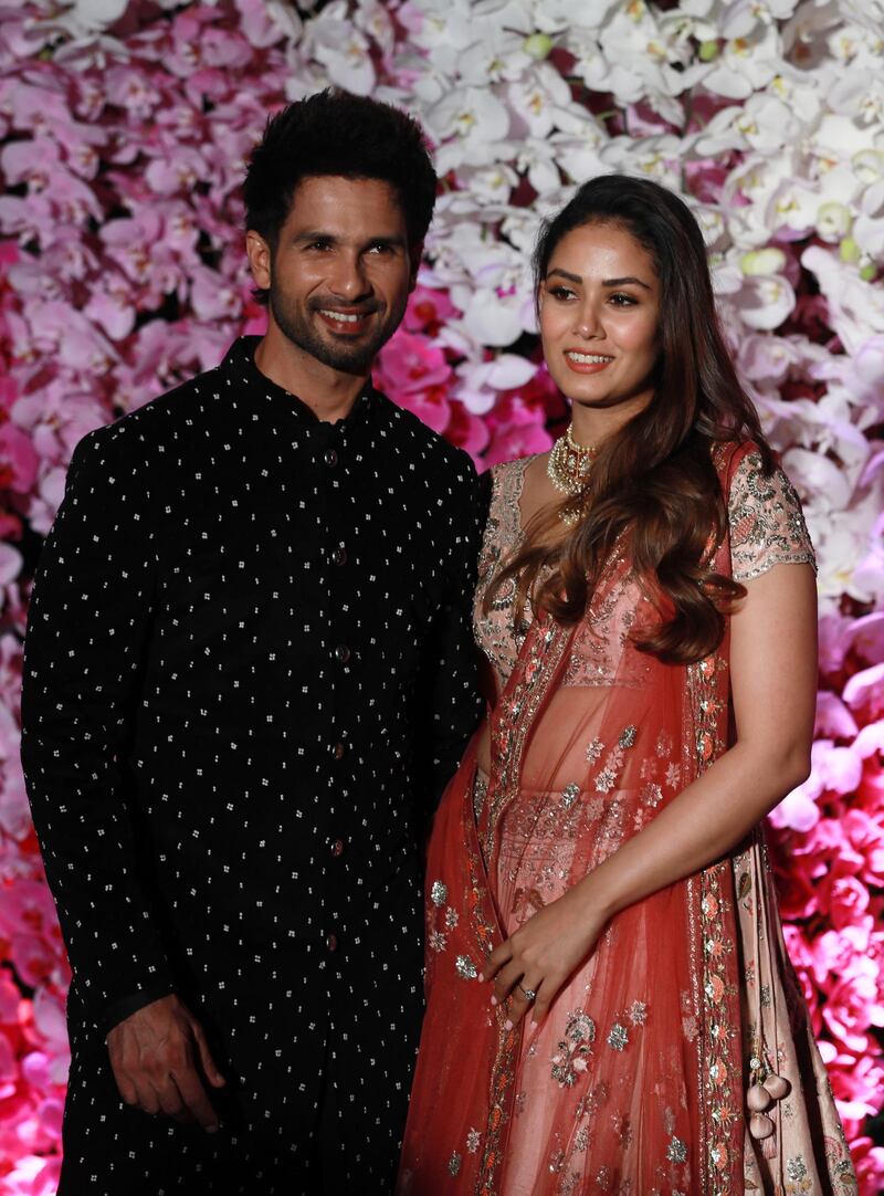 epa07427539 Bollywood actor Shahid Kapoor (L) and his wife Mira Rajput pose as they arrive to attend the wedding reception of Akash Ambani, son of Reliance Industries Chairman Mukesh Ambani, in Mumbai, India, 10 March 2019. Akash Ambani got married to Shloka Mehta on 09 March 2019.  EPA-EFE/DIVYAKANT SOLANKI