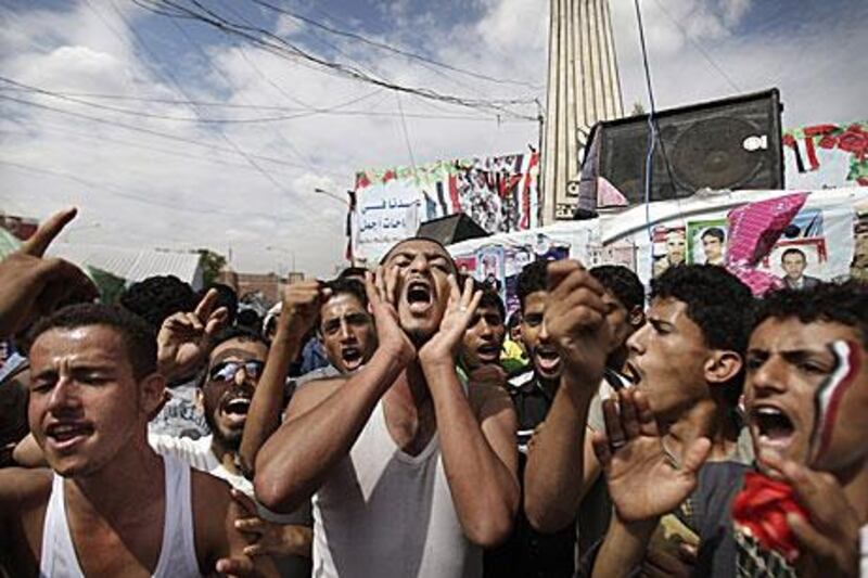 Yemeni protestors chant slogans during a demonstration against President Ali Abdullah Saleh's deal which will give him immunity from prosecution.