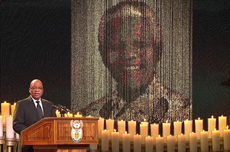 A screengrab taken from the South African Broadcasting Corporation live feed shows South Africa President Jacob Zuma speaking during the funeral service. SABC / AFP Photo