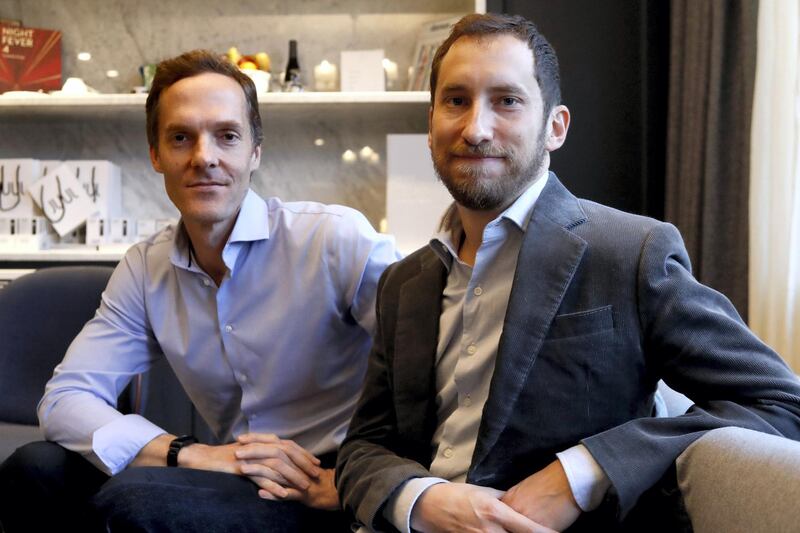 Co-founders of US start-up company Juul, Adam Bowen (L) and James Monsees pose in Paris on december 5, 2018. - The electronic cigarette Juul arrives in France after capturing 73% of the market in the United States in three years, where its popularity among teenagers worries the health authorities. (Photo by FRANCOIS GUILLOT / AFP)