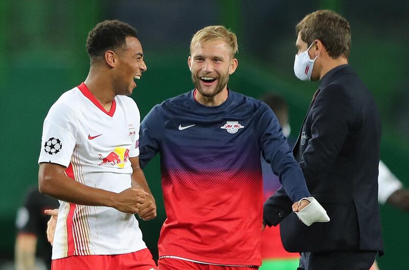 Tyler Adams, left, of Leipzig celebrates with teammate Konrad Laimer. EPA