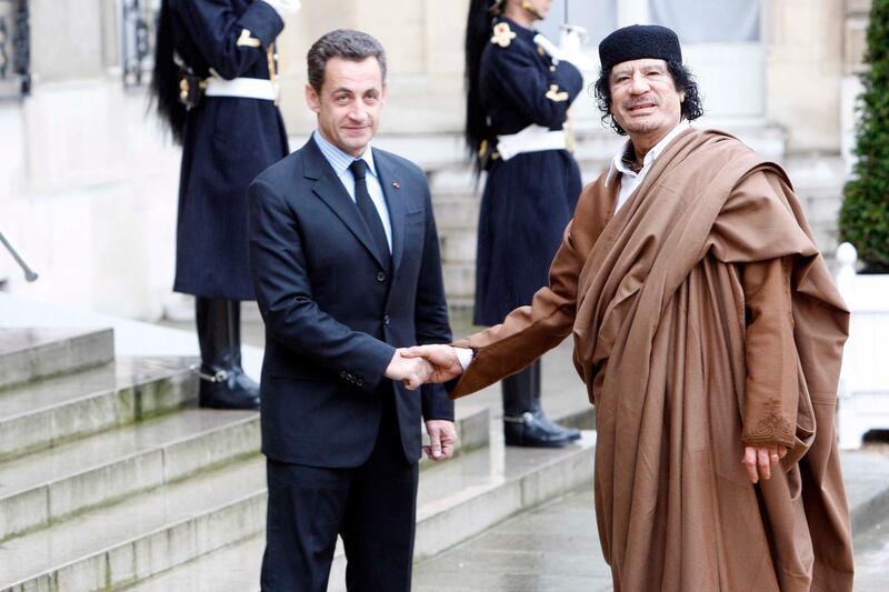 PARIS, FRANCE- DECEMBER 10: French President Nicolas Sarkozy welcomes Colonel Gaddafi at Le palais de l'Elysee on December 10, 2007 in Paris, France. The Libyan leader Muammar Gaddafi will spend five days in France, his first visit in over 30 years, to discuss trade and military deals. (Photo by Michel Dufour/WireImage)