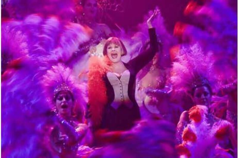 Portraying Lilli, the actress Judi Dench performs Folies Bergere with showgirls during a number in Rob Marshall's Nine.