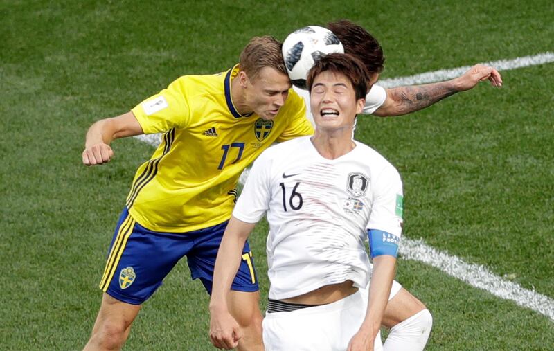 South Korea's Ki Sung-yueng, right, and Sweden's Viktor Claesson challenge for the ball. Michael Sohn / AP Photo