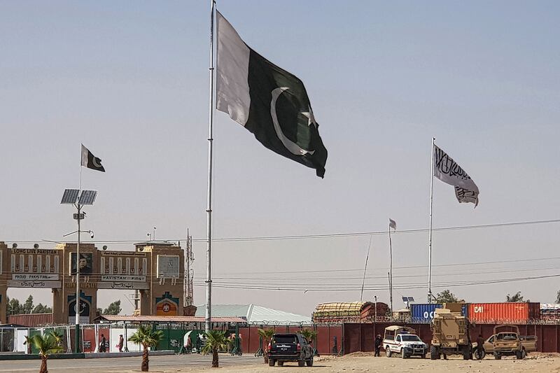 Pakistan and Taliban flags flutter on their respective border sides as seen from Chaman in Pakistan this week. AFP