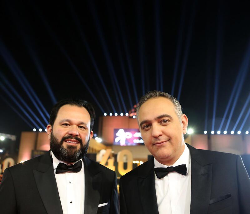 Cairo International Film Festival executive director Omar Kassem (L) and President Mohamed Hefzy pose on the red carpet at the closing ceremony of the 40th edition of the festival in Cairo. Photo / AFP