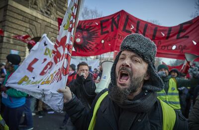 PARIS, FRANCE - JANUARY 24: Protesters take to the streets of Paris to demonstrate against President Macrons controversial pension reforms on the day the pensions reform bill will be formally presented for review by the Council of Ministers on January 24, 2020 in Paris, France. Dubbed Black Friday by participating unions, today marks the 51st consecutive day of strikes and the 7th day of national strikes. (Photo by Kiran Ridley/Getty Images)