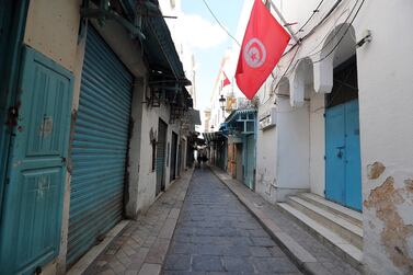 An empty street in Tunisia's capital of Tunis following the closure of businesses due to the coronavirus pandemic. Tunisia's economy is projected to shrink 4.3 per cent in 2020. EPA