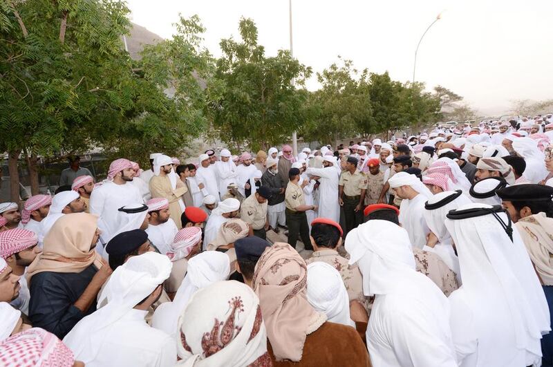 Men carry the body of Ahmed Al Mazroui to his final resting place following prayers at Shabieat Al Hossen Mosque in Wadi Al Helo, in the presence of Sheikh Salem Al Qasimi, chairman of the Sharjah Ruler’s Office. Wam