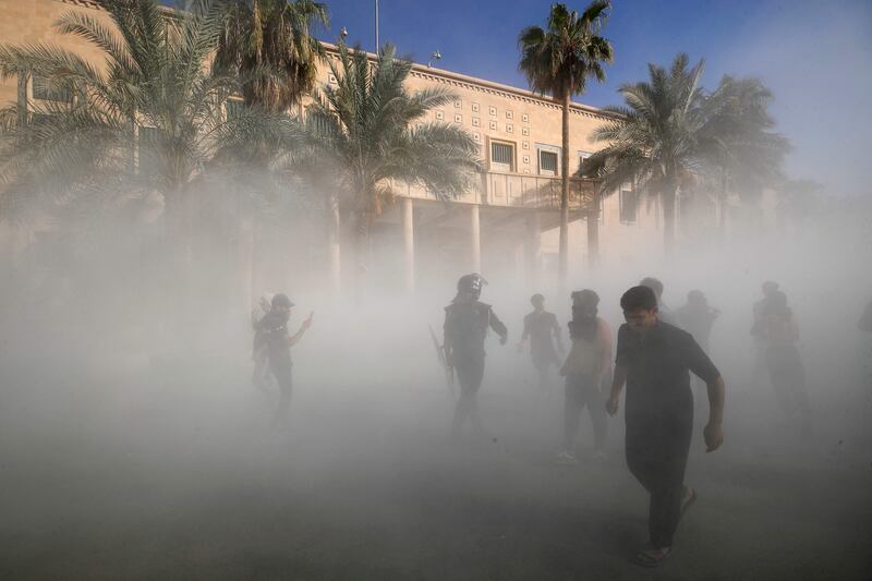 Supporters of Mr Al Sadr gather in the Green Zone. AFP