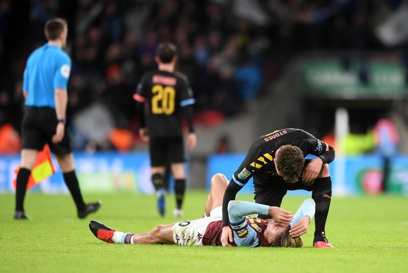 Jack Grealish lies on the pitch after Aston Villa's defeat in the League Cup final. Getty Images