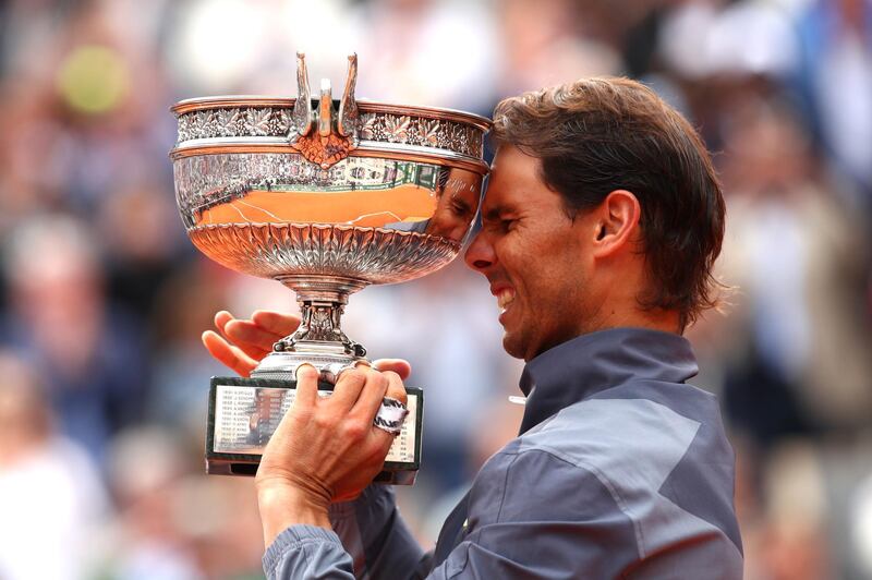 Rafael Nadal of Spain celebrates with the trophy following the men's singles final against Dominic Thiem of Austria at the 2019 French Open at Roland Garros in Paris, France. Getty Images