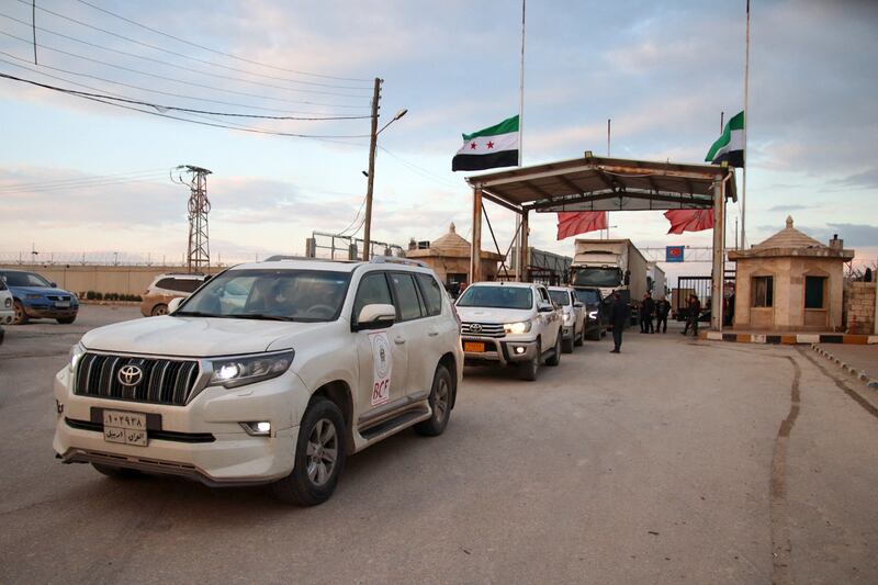 A Kurdish charity's aid convoy enters Syria through the Bab Al Salama crossing with Turkey, in the northern province of Aleppo. AFP