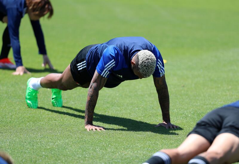 Anderson Lopes does push-ups during a Yokohama F Marinos training session in Kurihama, Japan. 