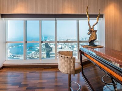 Palm Jumeirah views from the bar area of the Elite Residence penthouse. Photo: Luxhabitat Sotheby's International Realty