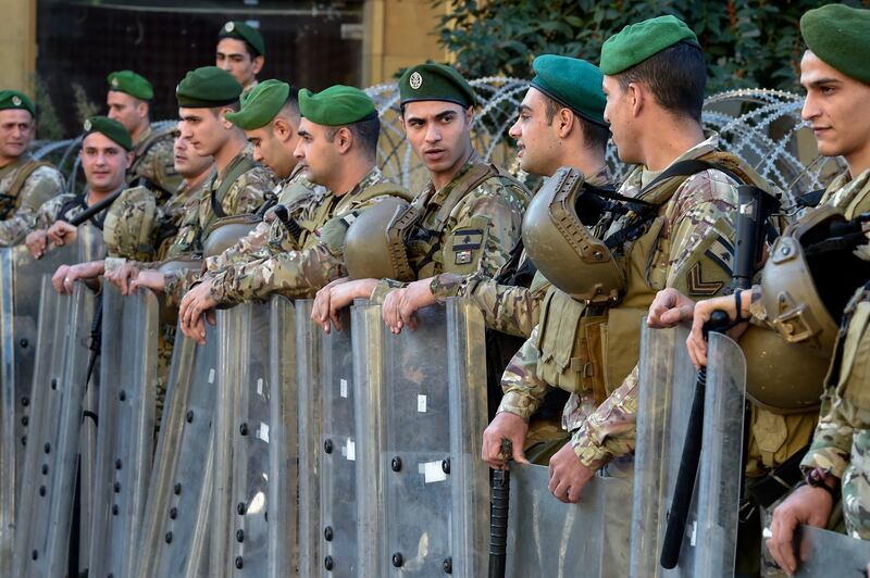 Lebanese army soldiers stand guard during a protest by retired members of security outside the government palace in Beirut last December. EPA