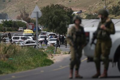 Israeli security forces examine the scene of a shooting near the Israeli settlement of Hamra in West Bank at the Jordan Valley on Friday. AP