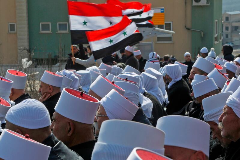 Druze residents of the Golan Heights take part in a rally in the village of Majdal Shams in the Israeli-annexed Golan Heights to protest against the 1981 Israeli annexation law of the strategic plateau which the Jewish state captured from Syria during the 1967 Arab-Israeli war. AFP