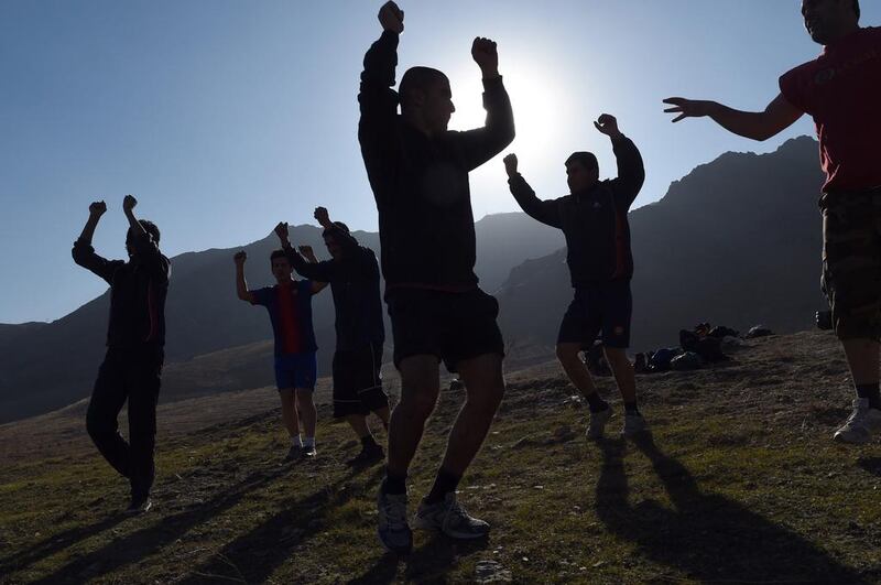 Afghan boxing athletes warm up during a training session at Badam Bagh hillside overlooking Kabul. Afghan youth have made headways in boxing since the fall of the Taliban, who declared the sport to be “against human dignity” during their hardline rule and banned it, along with most other forms of entertainment. Wakil Kohsar / AFP