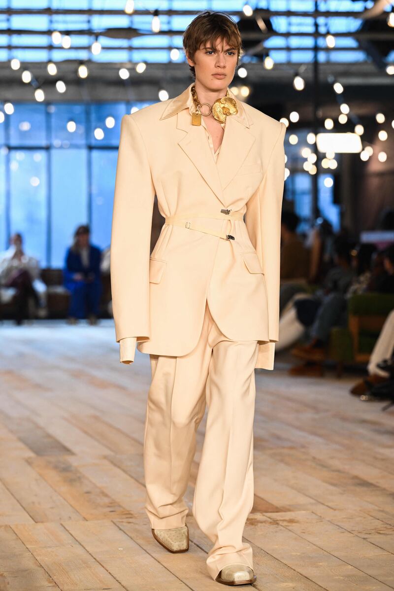 At Sportmax, an oversized suit was held closed with fasteners for autumn/winter 2023. AFP 