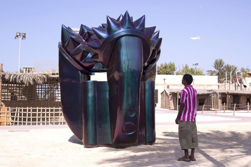 - A man looks at the public art installation Alien Technology by Monira Al Qadiri at the Shindagha Heritage Centre. Courtesy Clint McLean 

