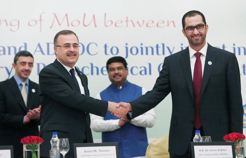 Saudi Aramco Chief Executive Officer Amin Nasser shakes hands with ADNOC CEO Ahmed al Jaber, also a minister of state of the UAE government, after signing a Memorandum of Understanding (MOU) as India's Oil Minister Dharmendra Pradhan and UAE's Foreign Minister Sheikh Abdullah bin Zayed Al Nahyan watch, during an event in New Delhi, India, June 25, 2018. REUTERS/Adnan Abidi