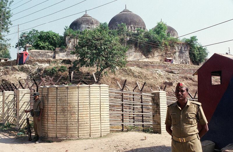 FILE - In this Oct. 29, 1990, file photo, security officers guard the Babri Mosque in Ayodhya, closing off the disputed site claimed by Muslims and Hindus. An Indian court on Wednesday acquitted all 32 people who had been accused of crimes in a 1992 attack and demolition of the 16th century mosque that sparked Hindu-Muslim violence leaving some 2,000 people dead. Four senior leaders of the ruling Hindu nationalist Bharatiya Janata Party had been among the defendants at the trial that languished in Indiaâ€™s sluggish legal system for almost 28 years. (AP Photo/Barbara Walton, File)