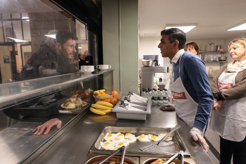 Mr Sunak prepares and serves breakfast on a visit to The Passage homeless shelter in London just before Christmas. Photo: Simon Dawson / No 10 Downing Street