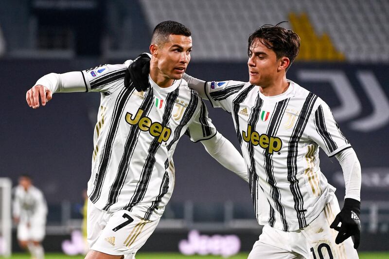 Juventus star Cristiano Ronaldo, left, celebrates scoring with teammate Paulo Dybala after scoring against Udinese. AP