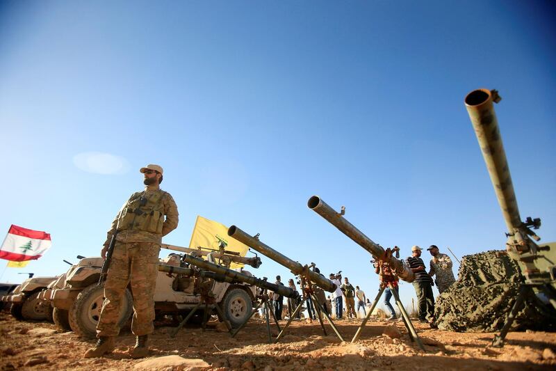 A Hezbollah fighter stands in front of anti-tank artillery at Juroud Arsal, the Syria-Lebanon border, July 29, 2017. REUTERS/Ali Hashisho     TPX IMAGES OF THE DAY