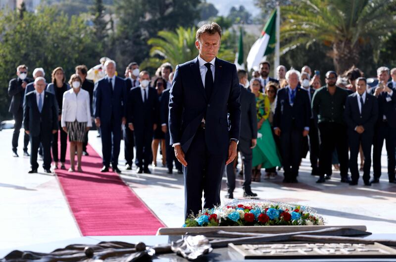 Laying a floral wreath at the Martyrs Monument in Algiers. AFP