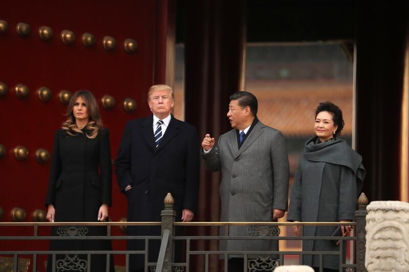 President Donald Trump, first lady Melania Trump, accompanied by Chinese President Xi Jinping and his wife Peng Liyuan tour the Forbidden City in Beijing, China. Andrew Harnik / AP Photo