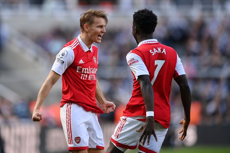 Martin Odegaard of Arsenal celebrates after scoring the opening goal with teammate Bukayo Saka. Getty 