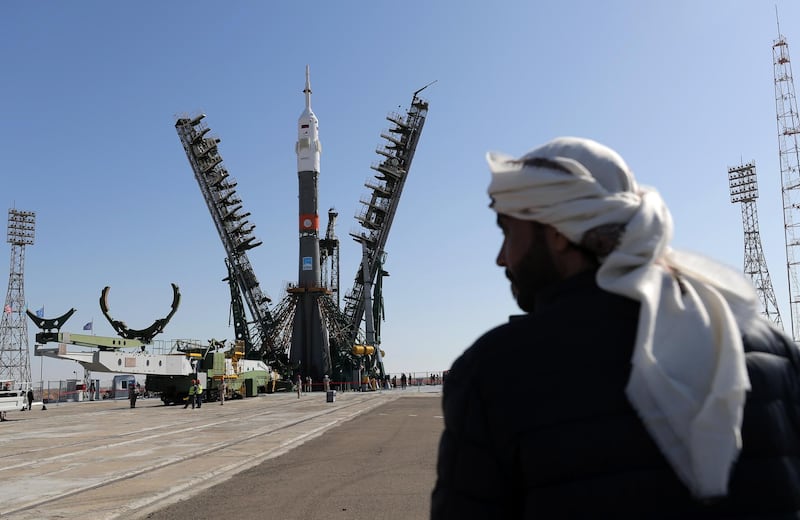 An Emirati official looks on as the MS-15 spacecraft and the rocket carrying it is installed on the launch pad at the Baikonur Cosmodrome on Monday, ahead of the launch on Wednesday evening. Maxim Shipenkov / EPA