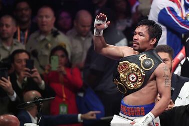 LAS VEGAS, NEVADA - JULY 20: Manny Pacquiao celebrates his split-decision victory over Keith Thurman in their WBA welterweight title fight at MGM Grand Garden Arena on July 20, 2019 in Las Vegas, Nevada. Ethan Miller/Getty Images/AFP == FOR NEWSPAPERS, INTERNET, TELCOS & TELEVISION USE ONLY ==
