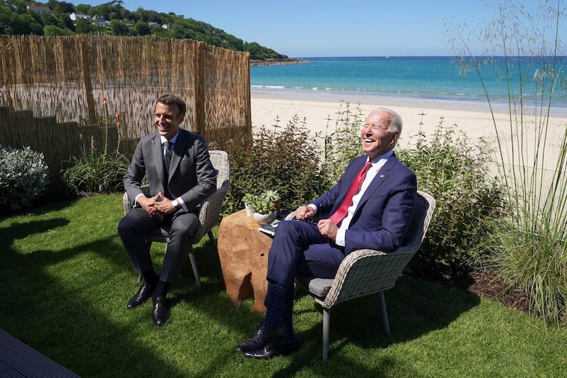 US President Joe Biden and France's President Emmanuel Macron attend a bilateral meeting. Reuters