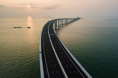 An aerial view taken on October 22, 2018, shows a section of the Hong Kong-Zhuhai-Macau Bridge (HKZM) in Hong Kong.   The world's longest sea-bridge connecting Hong Kong, Macau and mainland China will be launched October 23, at a time when Beijing seeks to tighten its grip on its territories.  / AFP / Anthony WALLACE

