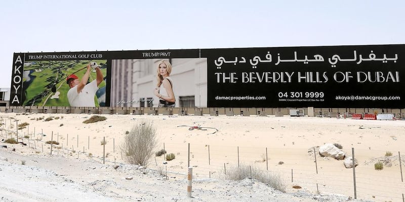 The advertisement of Akoya by Damac near Arabian Ranches in Dubai featuring Donald Trump. Pawan Singh / The National