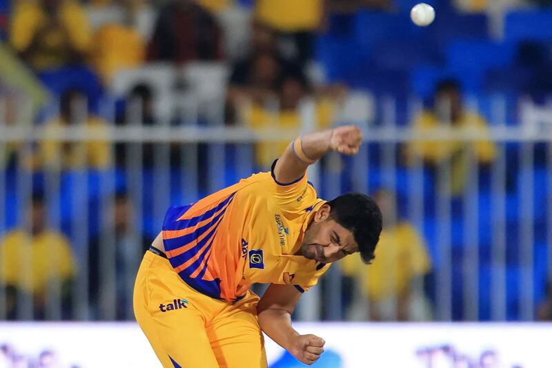 Sharjah Warriors' Junaid Siddique bowls during the ILT20 match against MI Emirates at the Sharjah Cricket Stadium. AFP