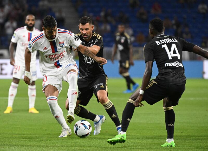 Lyon's Brazilian midfielder Lucas Paqueta fights for the ball with Ajaccio's French midfielder Thomas Mangani. AFP