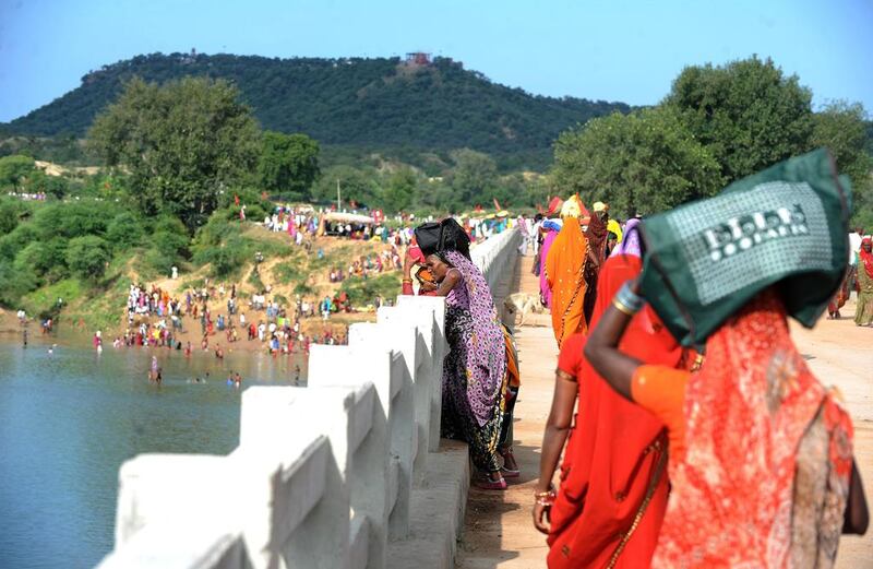 Indian Hindu pilgrims on the bridge where a deadly stampede took place the previous day near the Ratangarh temple in the Datia district of central Madhya Pradesh. Sajjad Hussain / AFP



