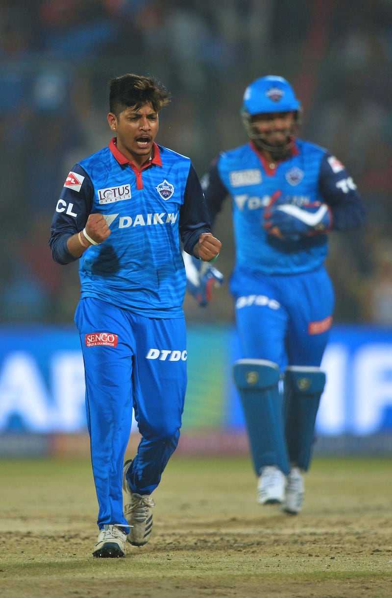 (FILES) In this file photo taken on April 20, 2019, Delhi Capitals bowler Sandeep Lamichhane (L) of Nepal celebrates after he dismissed Kings XI Punjab cricketer Chris Gayle during the 2019 Indian Premier League (IPL) Twenty20 cricket match between Delhi Capitals and Kings XI Punjab at the Feroz Shah Kotla cricket stadium in New Delhi.  The United States were bowled out for 35 by Nepal on February 12 and joined Zimbabwe in making the lowest total in a 50 over international. Nepal leg spinner Sandeep Lamichhane was wrecker-in-chief, taking six for 16 as the American side were finished off in 12 overs in the World Cup league two match in Kathmandu. - ----IMAGE RESTRICTED TO EDITORIAL USE - STRICTLY NO COMMERCIAL USE-----
 / AFP / Sajjad HUSSAIN / ----IMAGE RESTRICTED TO EDITORIAL USE - STRICTLY NO COMMERCIAL USE-----
