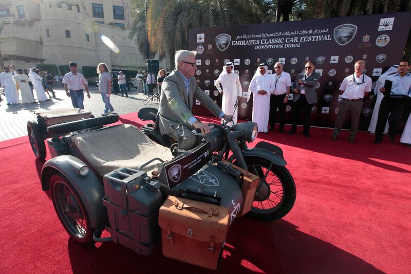 Dubai, United Arab Emirates - March 9, 2013.  Alexander Islamov from Russia with his World War 2 BMW also won The Best Show in Classic Motorcycle category, at the 5th Emirates Classic Car Festival.  ( Jeffrey E Biteng / The National )