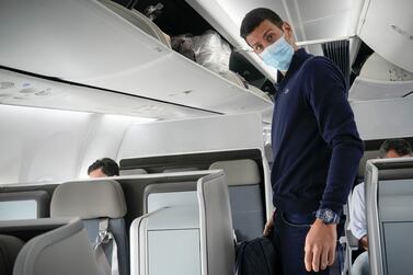 Novak Djokovic prepares to take his seat on a plane to Belgrade, in Dubai, United Arab Emirates, Monday, Jan.  17, 2022.  Djokovic was deported from Australia on Sunday after losing a bid to stay in the country to defend his Australian Open title despite not being vaccinated against COVID-19. (AP Photo / Darko Bandic)