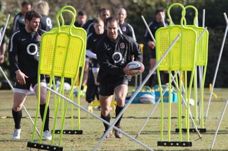 BAGSHOT, ENGLAND - FEBRUARY 15:  Charlie Hodgson runs with the ball during the England training session held at Pennyhill Park Hotel on February 15, 2012 in Bagshot, England.  (Photo by David Rogers/Getty Images)