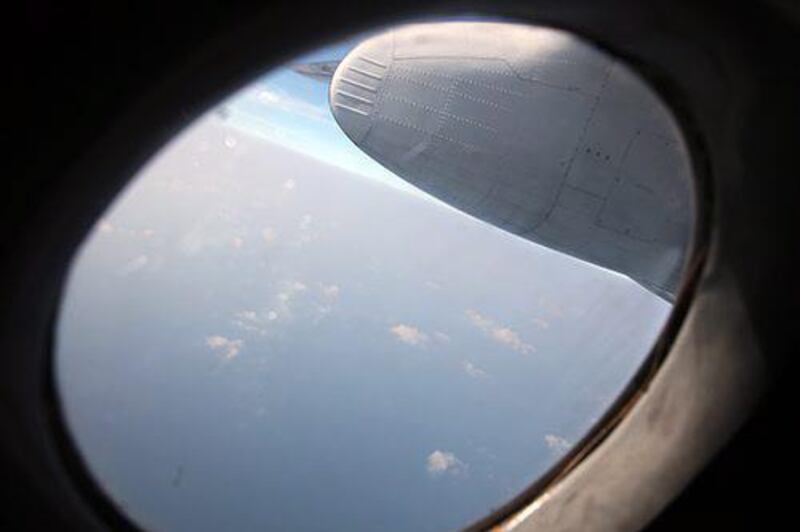 A handout picture provided by Petrotimes shows military personnel inside a Vietnamese Air Force plane during search and rescue operation. EPA