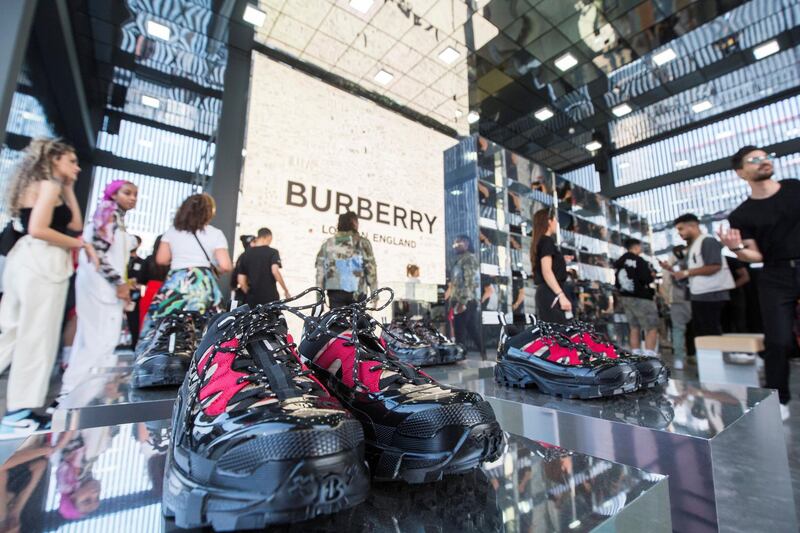 Dubai, United Arab Emirates- Visitors checking out shoes in one of the brand outlet at the Sole Dubai Festival at D3.  Leslie Pableo for The National for Saeed Saeed's story